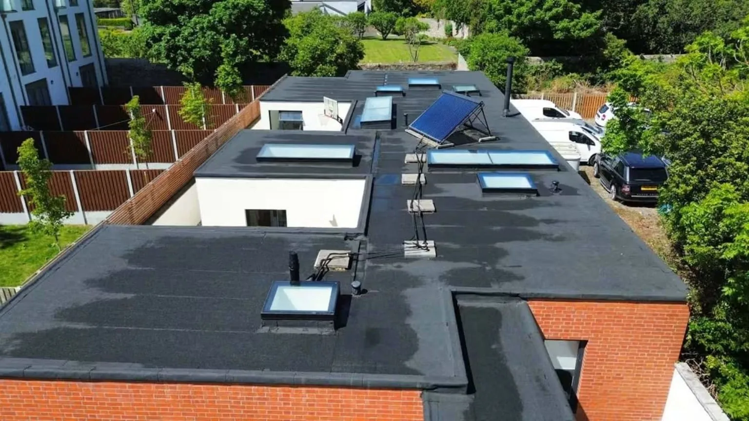 Flat roof levels with rooflights finished in torch-on felt, Dun Laoghaire