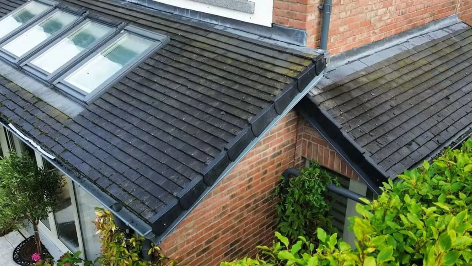 Dry verge beside roof windows on a tiled roof