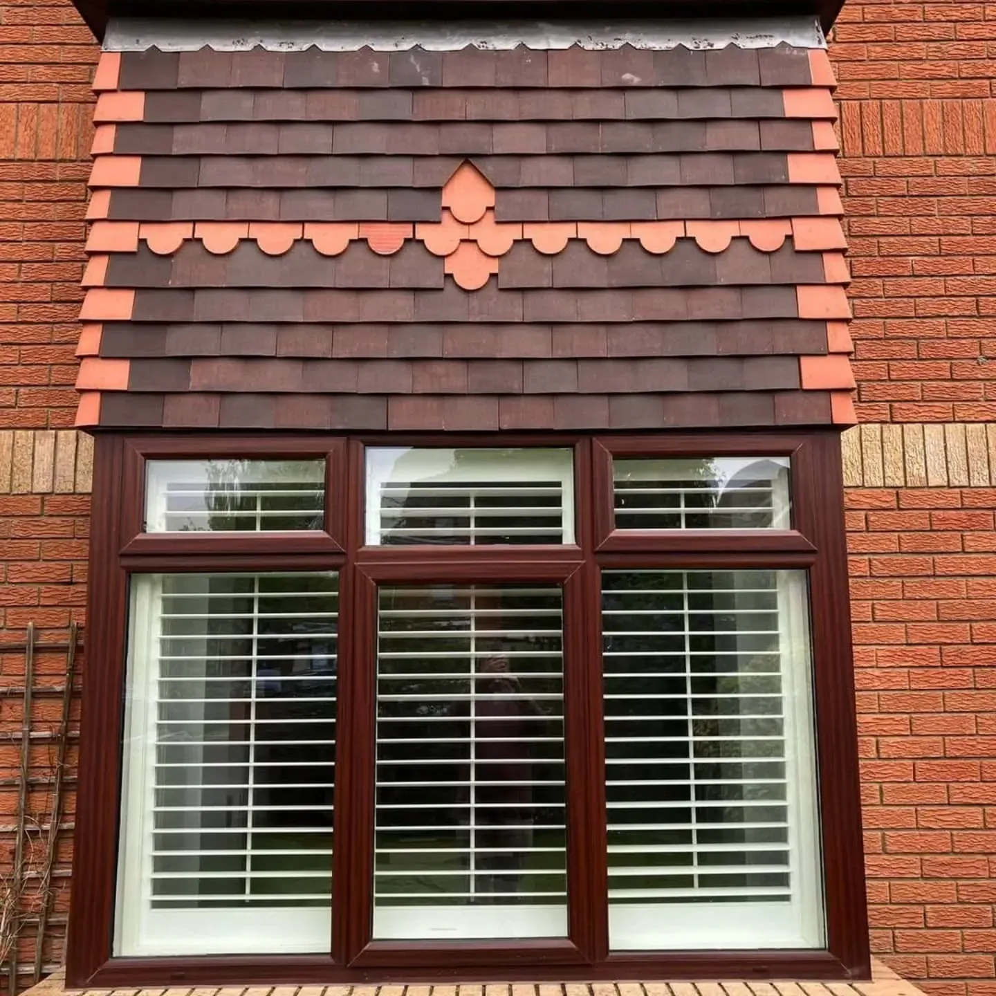 Bay window roof finished in red feature tiles