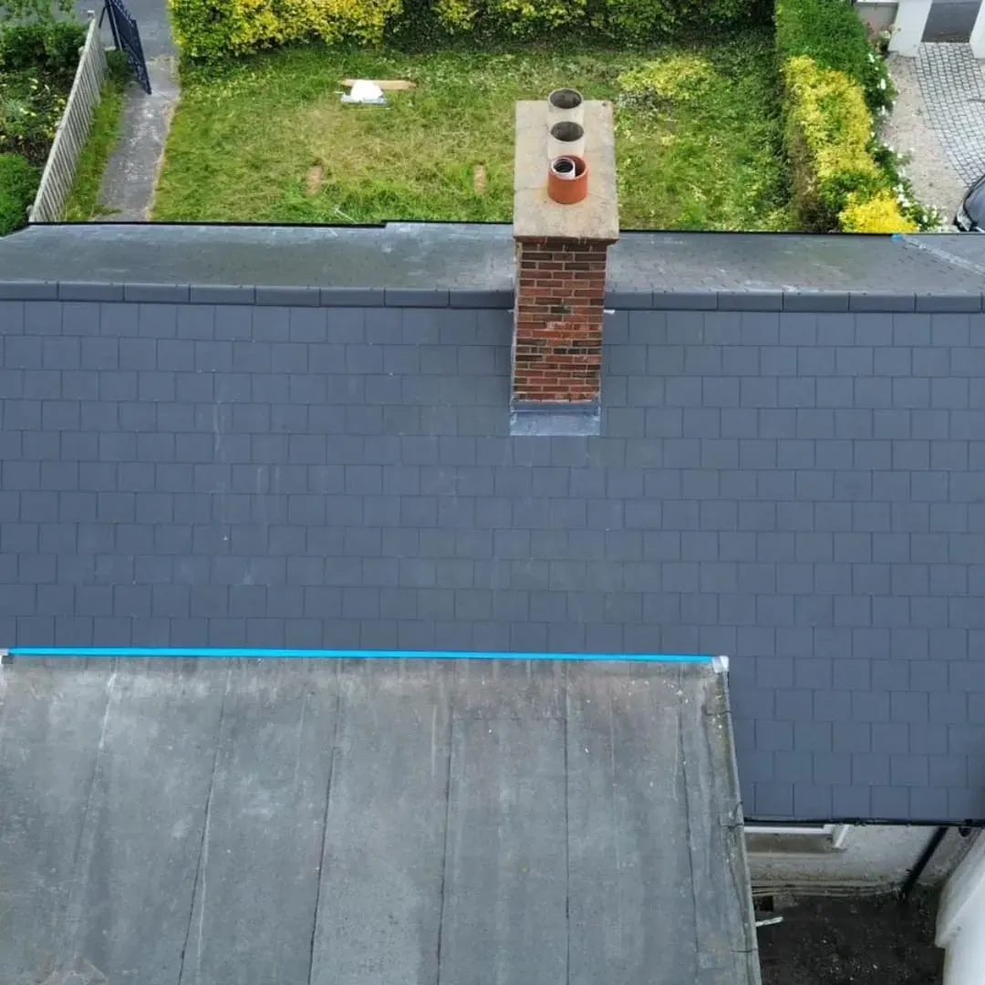 Slate roof with a brick chimney