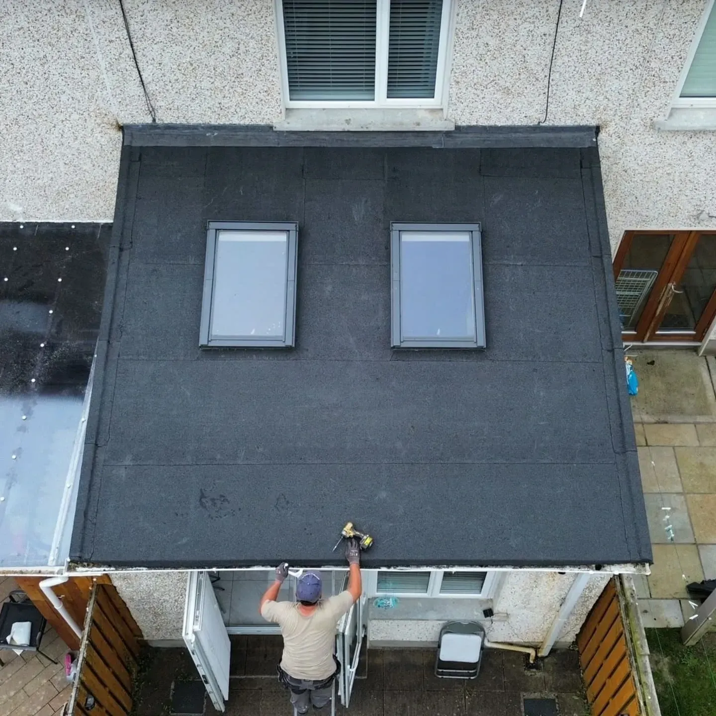 Flat roof with two rooflights over an extension