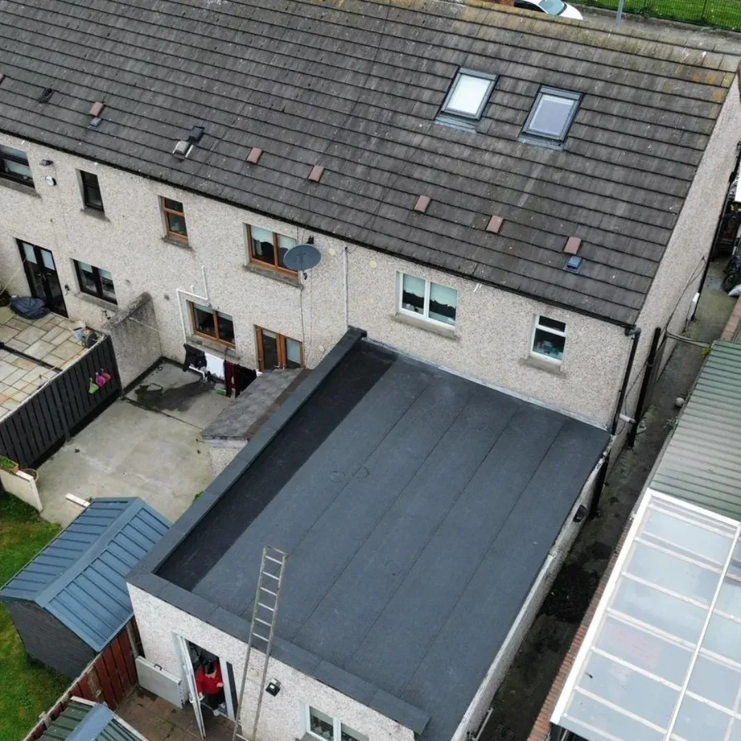 Flat roof extension behind a terrace