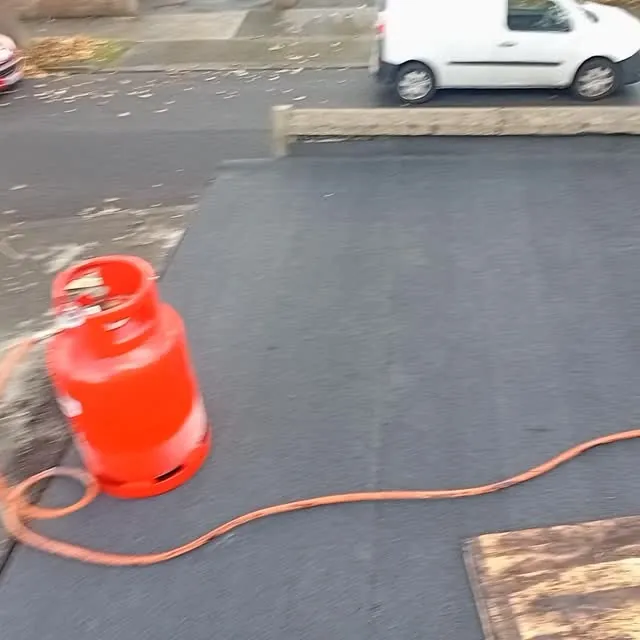 Torch-on felt flat roof in progress